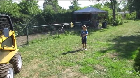 CHILDREN PLAY WITH THE R.C. SKID STEER LOADER