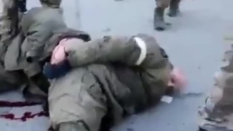 Ukraine Nazis shoot Russian POW in KNEES they bleed to death