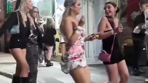 Beautiful girls get drunk on the streets of