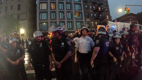 NYPD officers arrest people marching Black and Palestinian liberation.