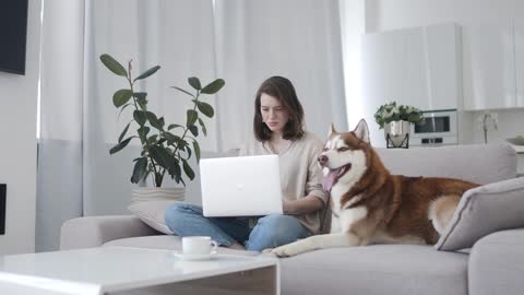 Woman and dog on a couch