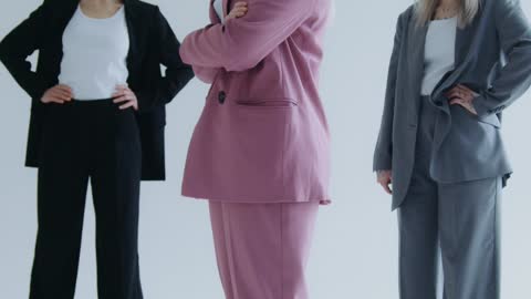 Women Wearing Business Suits and Posing