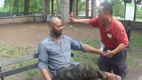 Luodong Massages Bald Black Man On The Park Bench