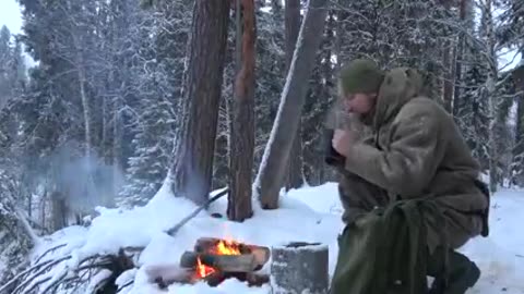 THE COMFORT OF A TINY LOG CABIN IN BAD WEATHER OFF GRID