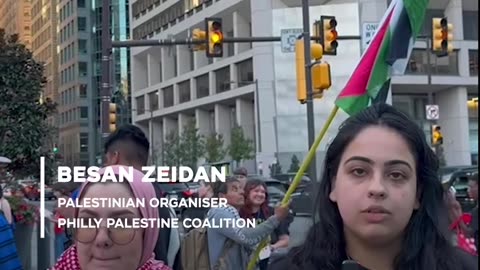 Pro-Palestinian protesters rally outside debate venue