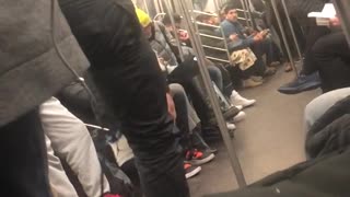 Subway performers swing on handrails and dance