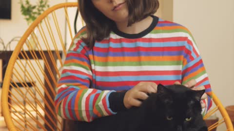 Woman petting a cat