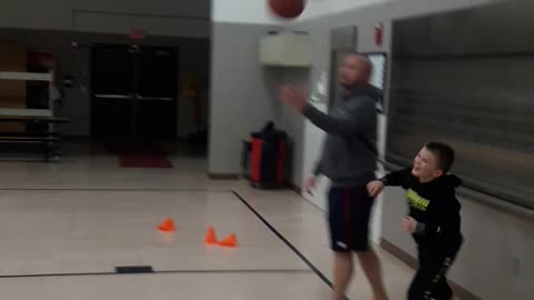 7 year old dribbles through trash defense.