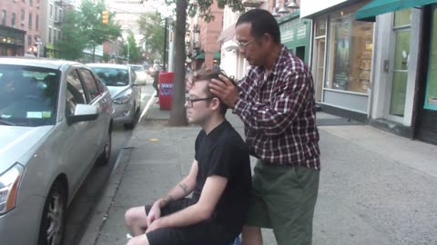 Luodong Massages White Tattooed Man On Sidewalk