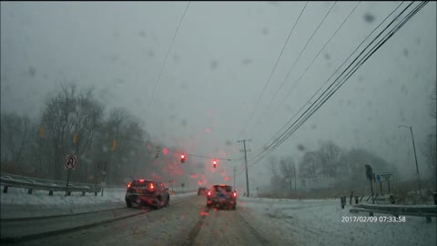 Slick road sliding and running a light