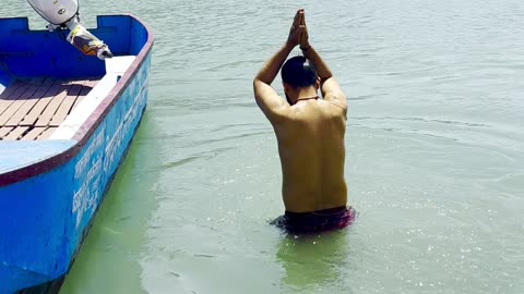 Taking a morning dip in the Ganga in Rishikesh India