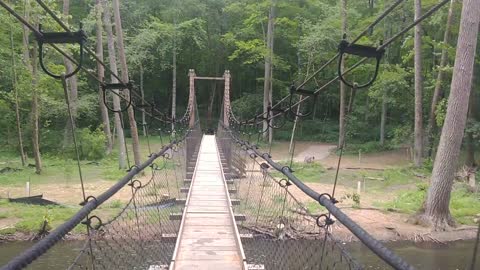 Crossing the suspension bridge along the trail at Mohican State Park