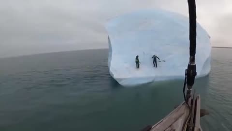 Massive iceberg flips over