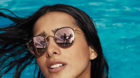 Woman face by the swimming pool