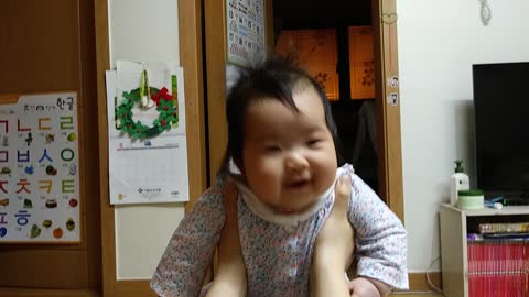 Korean baby smiling with excitement