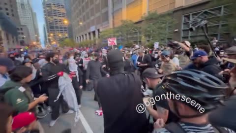 Pro Palestinian muslim supporters and partisans set American flag on fire in Chicago