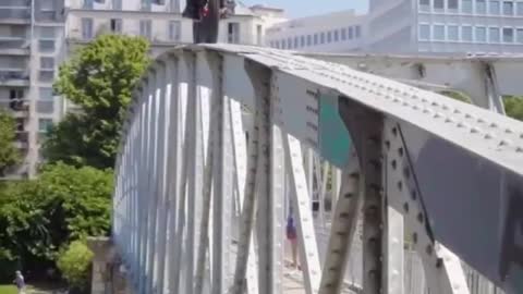 Amazing man doing stunts with bike over the bridge