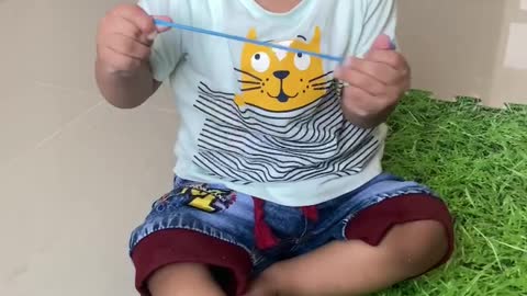 9 months baby playing with baloon and laughing alot