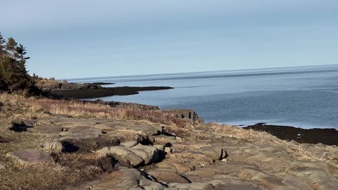 Looking Out Over A Ocean At Point Prim Lighthouse In Digby NS