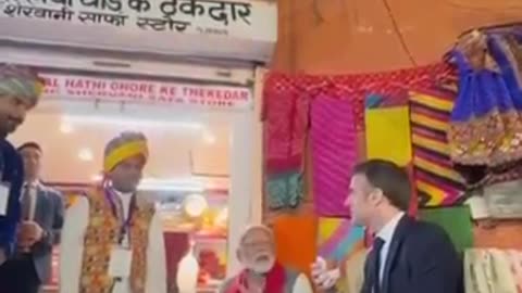 PM Modi & President Macron share light moments over Tea at a local shop in Jaipur