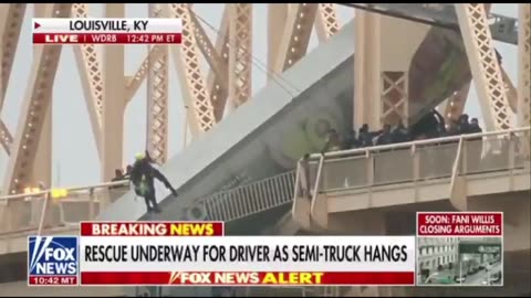 Dramatic Rescue Efforts can be seen as Semi-Truck Dangles Off the Bridge Connecting KY and IN