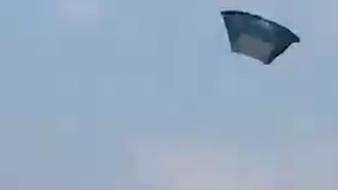 Group Of People Witness a Tent Flying In Air At Music Festival