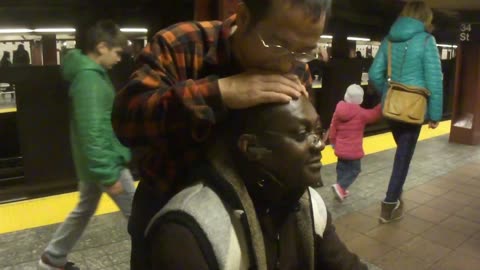 Luodong Massages Black Man In Subway Station