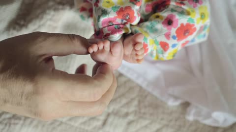 Young mother playing and loving her baby