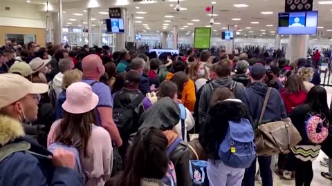 Chaos at Atlanta airport after felon's gun goes off