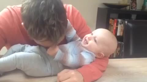 Cute baby playing with her dad