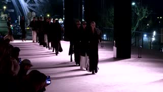 YSL sends evening gowns down Eiffel Tower runway