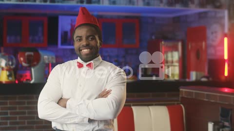 Waiter Smiling In A Typical American Diner