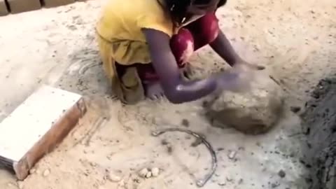 5 Years Old girl Making Bricks