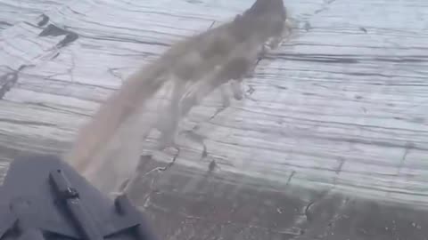 A river-like fountain flow piercing through a glacier