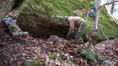 Four excavated shelter.Building underground bunker.Earth hut. primitive technology.Clay stone oven-5