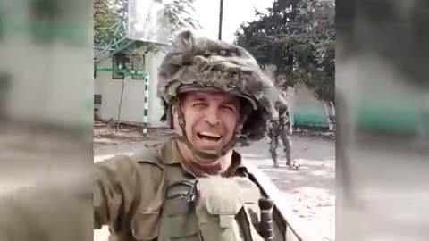 Israeli soldiers sing and raise a regime's flag in a Gaza school after occupying it