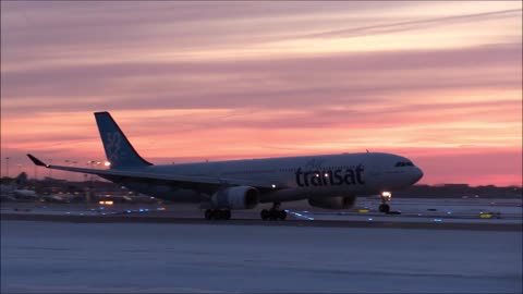 An Airplane Landing at an Airport During Winter Season