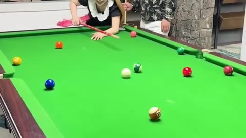 This lady can shot the cueball easily by using a broomstick as cue lol :-)