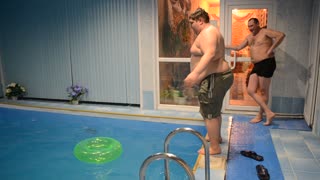 Dude amazingly manages to jump through tiny pool toy