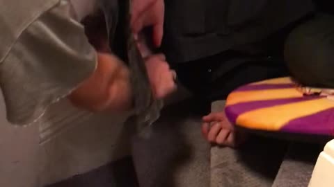 Guy tries to surf down stairs with orange boogie board