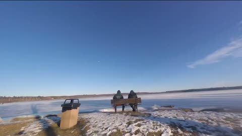 Drone chasing dirt bikes on a frozen lake