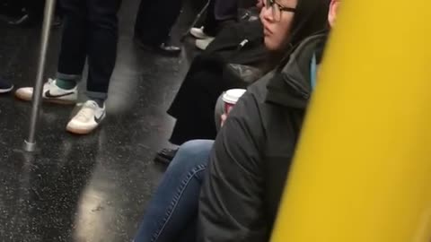 Woman red hair brushing teeth on train