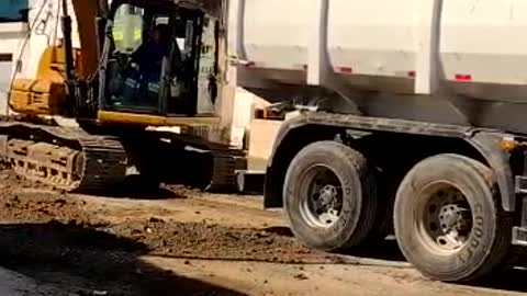 excavator preparing asphalt