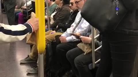 Man in suit drinks coffee from army mug