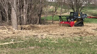 John Deere with Forestry Mower Attachment