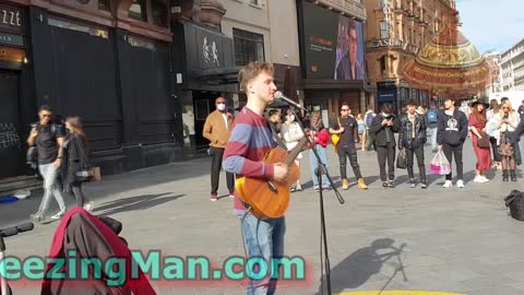 Street performer singing dance monkey