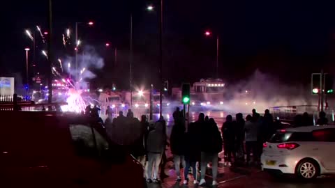 Police fire water cannon at Belfast protesters