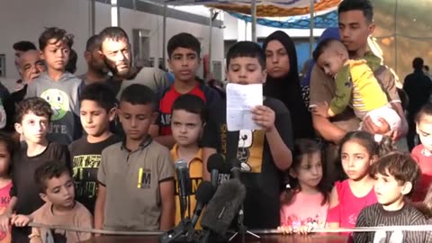 Palestinian children in Gaza hold a news conference