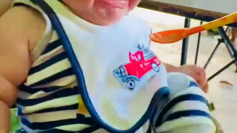 Baby first time eating solid food. His reaction is just amazing!