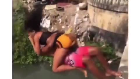 Brazilian couple jumping in polluted river